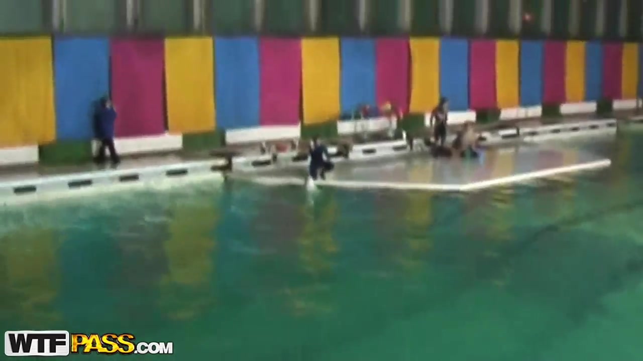 Cute and young brunette babe Natasha is getting seduced by her workmate at dolphinarium for naughty fuck.