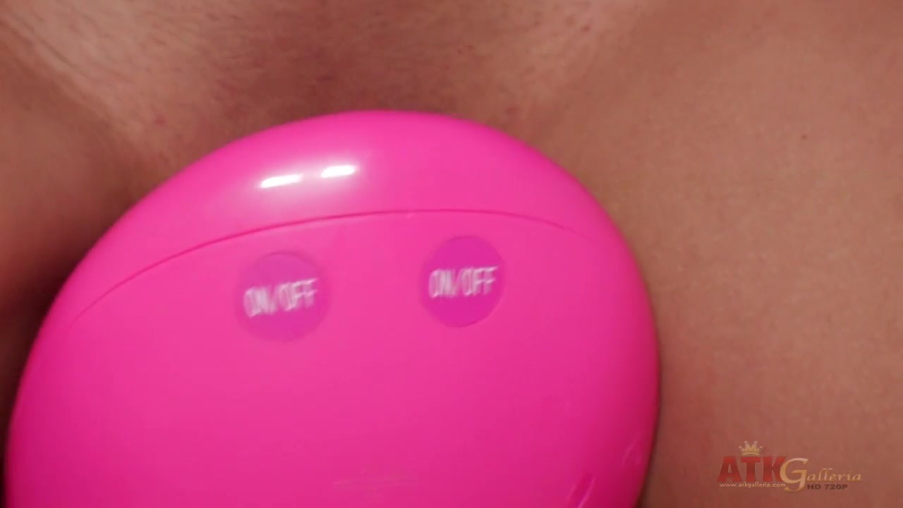 Exotic brunette riding a toy