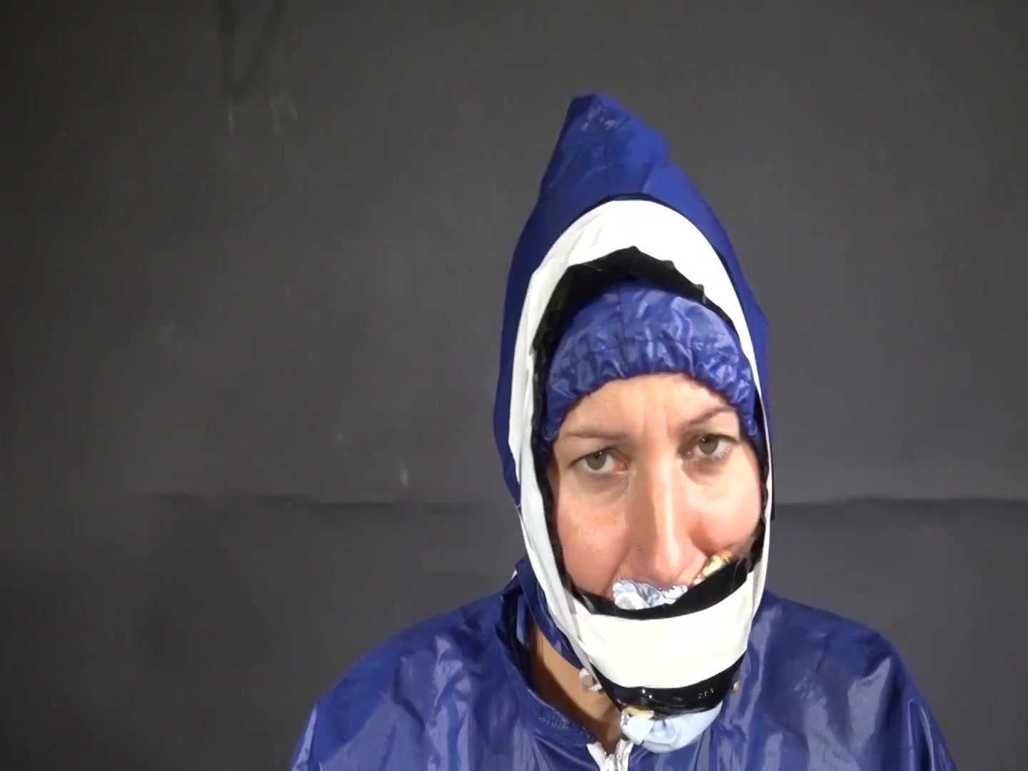 Watch Sandra Beeing Bound, Pantygagged And Finally Pantyhooded In Her Shiny Nylon Rainwear
