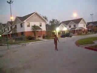 Curly black slut walks naked around the neighborhood