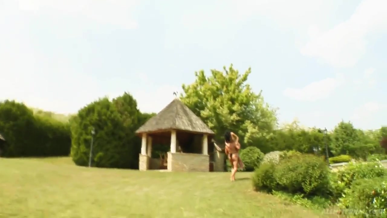 Slender hot brunette chick Shalina is standing on her knees in doggy pose outdoors and sucking her fuckerâ€™s dick.