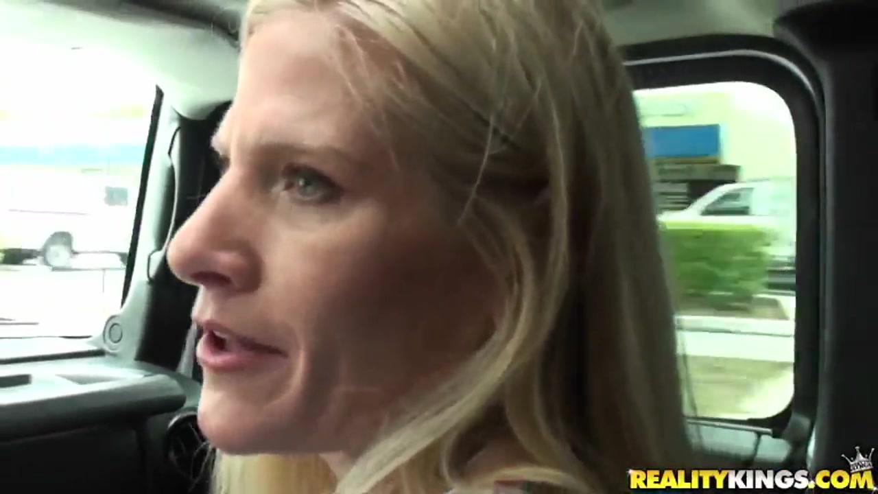 Mature blondie sucks throbbing penis in a car