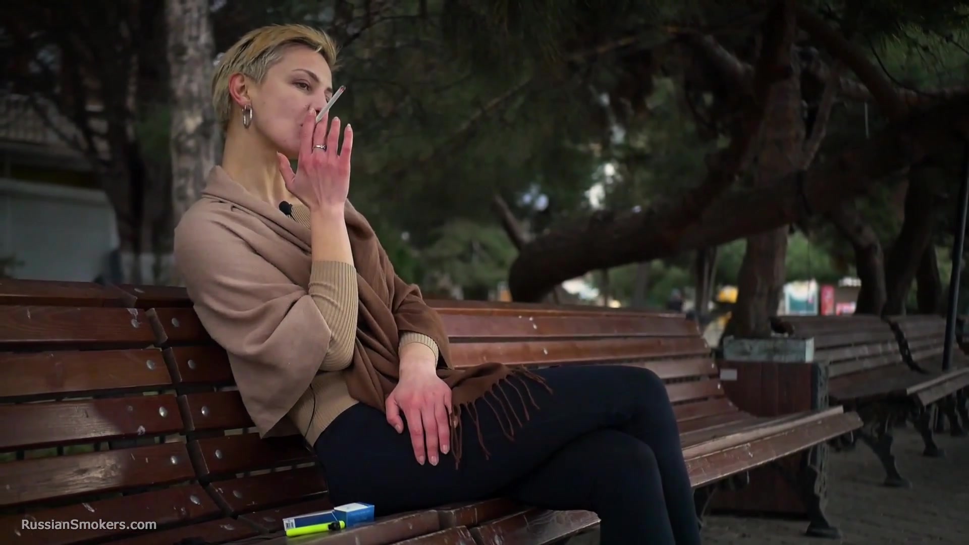 Short Cut Hair Blonde Girl Is Smoking All White 120mm Cigarettes