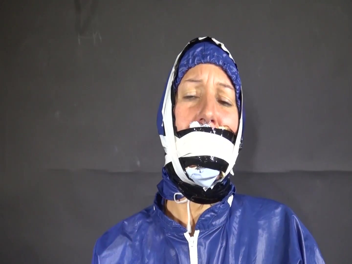 Watch Sandra Beeing Bound, Pantygagged And Finally Pantyhooded In Her Shiny Nylon Rainwear