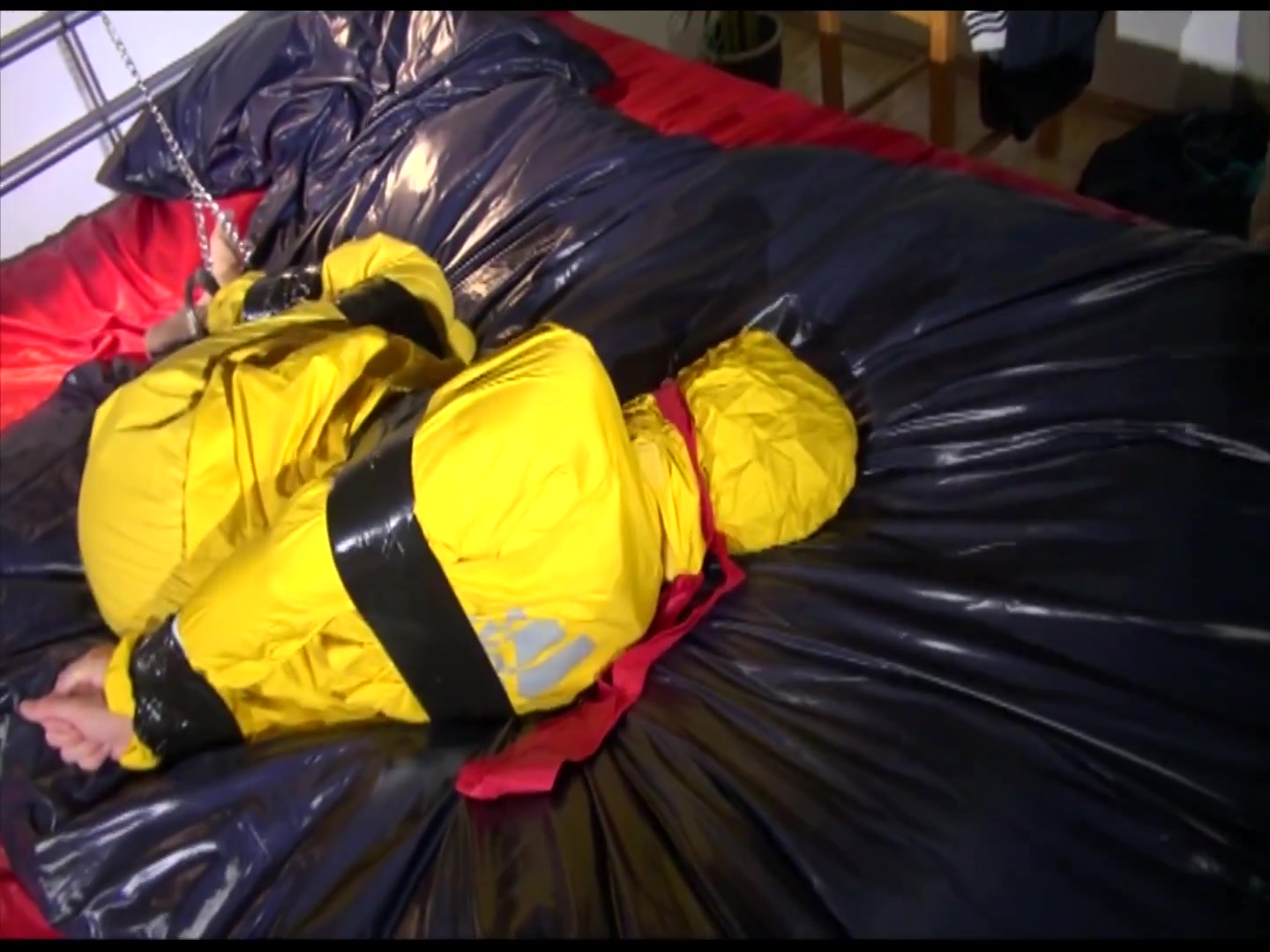 Get 2 Archivevideos With Sonja Enjoying Bondage In Her Shiny Nylon Rainwear