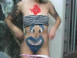 Tattooed dark-haired webcam model teasing the viewer