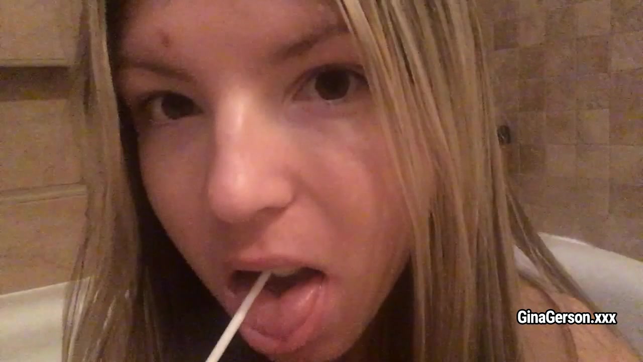 Gina Gerson sucks candy and shows her body during taking bath