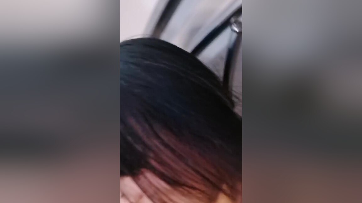 A camera in the restroom catches an Asian woman urinating.