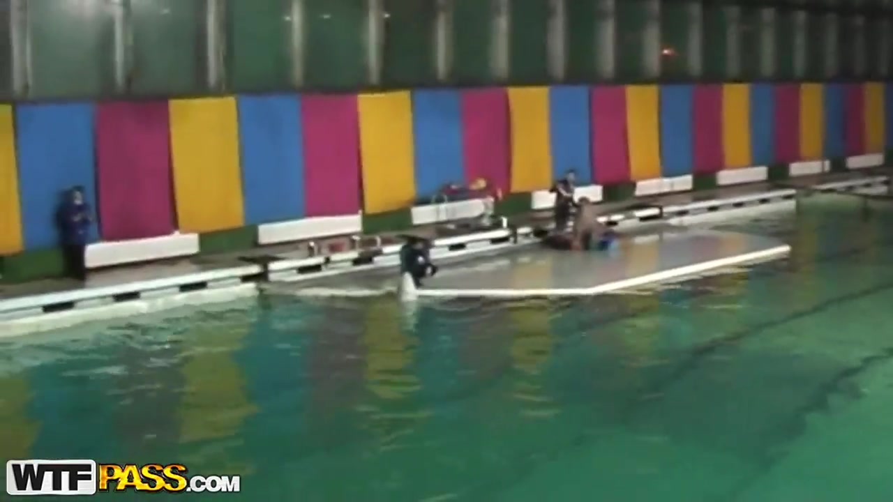 Cute and young brunette babe Natasha is getting seduced by her workmate at dolphinarium for naughty fuck.