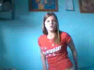 Redhead girl takes off sexy jeans and caresses herself