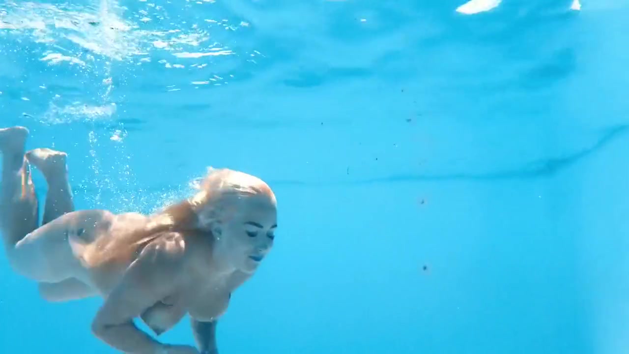 A Woman Floats In A Butterfly-adorned Mesh Dress