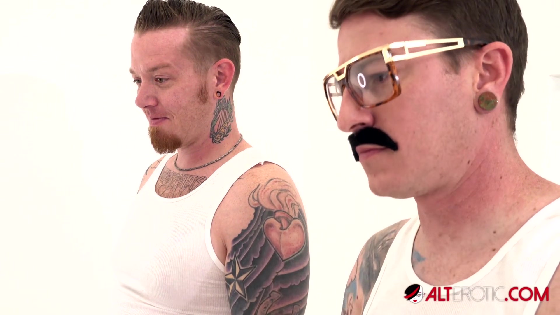 Busty inked hottie Misha Montana takes on two dicks