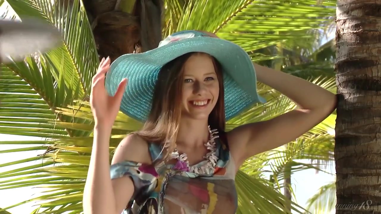 Sexy teen 18+ In A Hat And Dress Poses