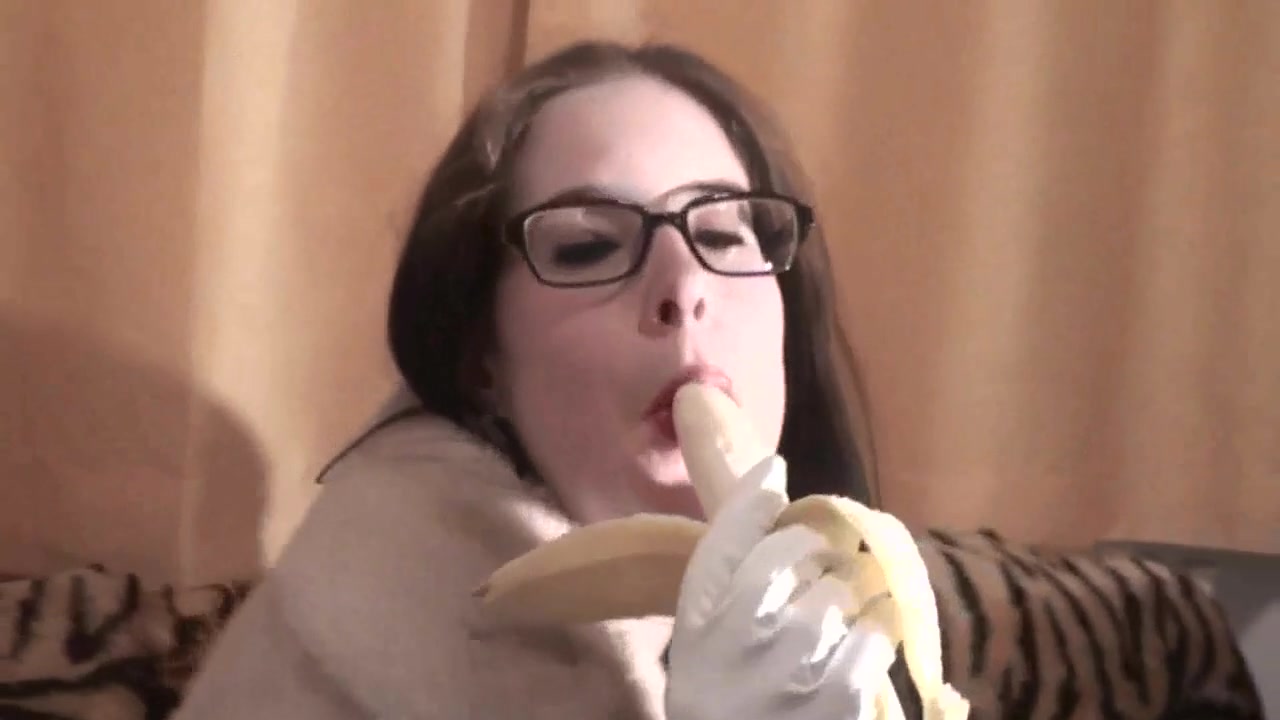 Spex brunette talking dirty while eating banana by Femdom Austria