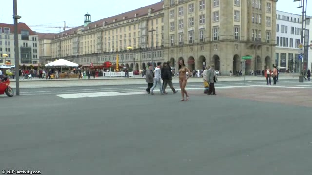 Long haired brunette walks naked in public in hd movie