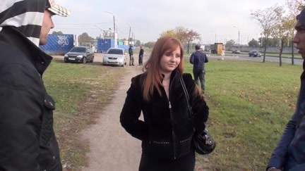 Breasty redhead oral-sex in a park