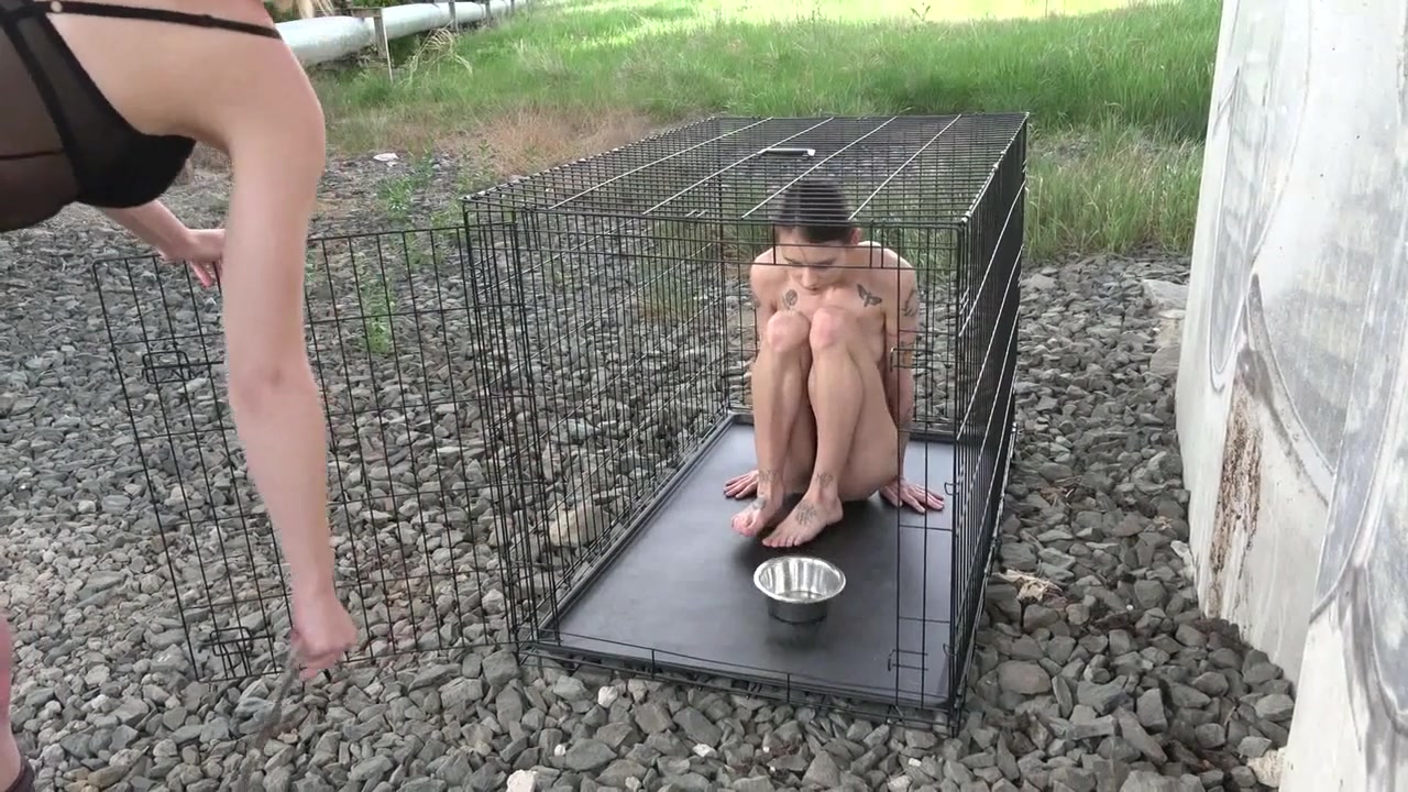 Exposed in the public pillory cage by Femdom Austria