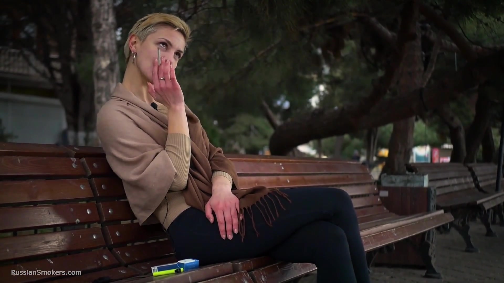 Short Cut Hair Blonde Girl Is Smoking All White 120mm Cigarettes