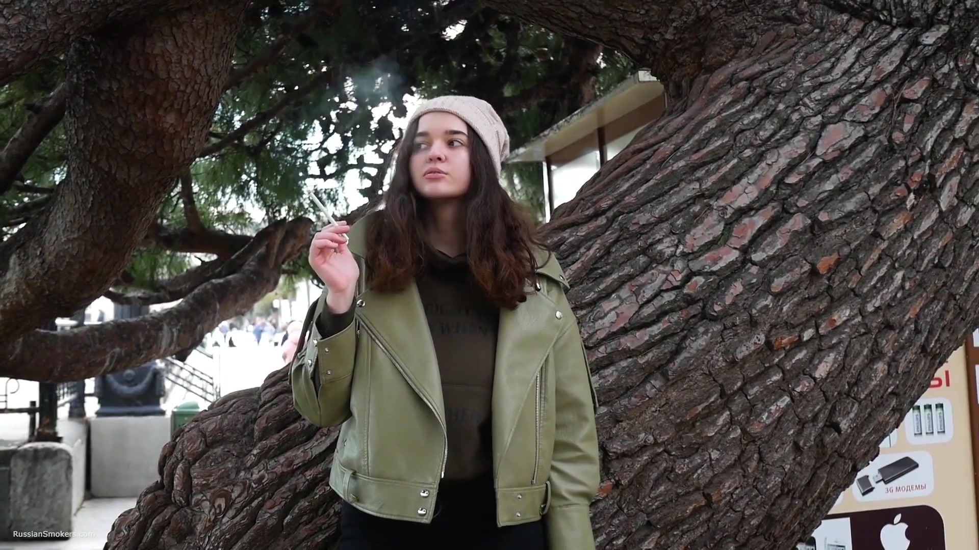 Young Brunette Is Taking An Unhurried Stroll With Allwhite 120mm Cigarette