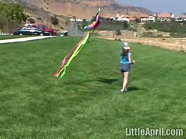 Cute Little April Outdoors Sucking A Popsicle