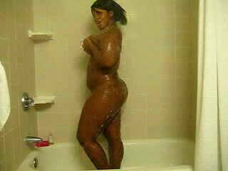 Ebony bitch with curves washes her brown twat in the shower