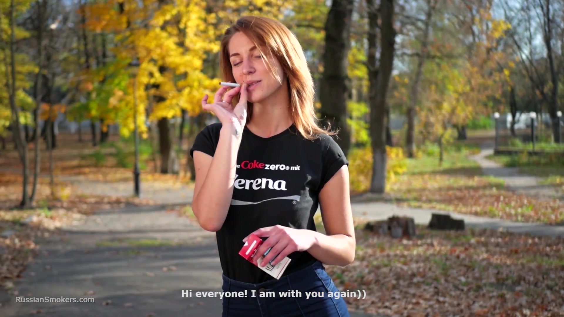 Sasha Is Smoking Two Cigarettes One By One In The Autumn Park