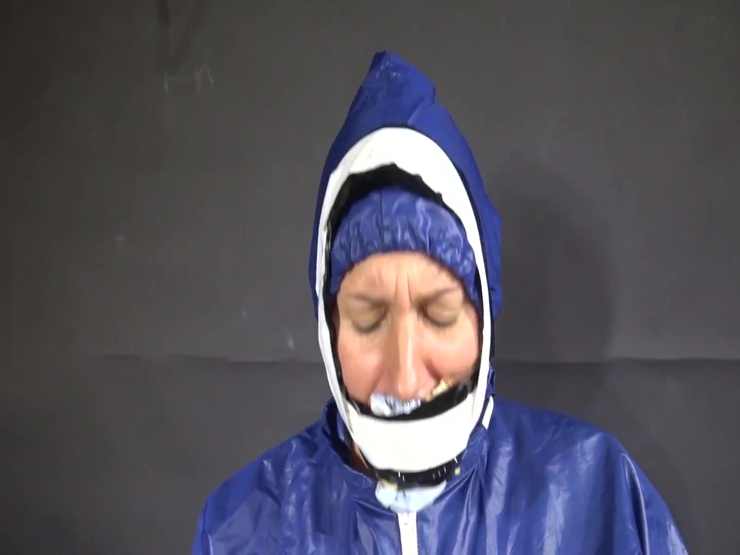 Watch Sandra Beeing Bound, Pantygagged And Finally Pantyhooded In Her Shiny Nylon Rainwear