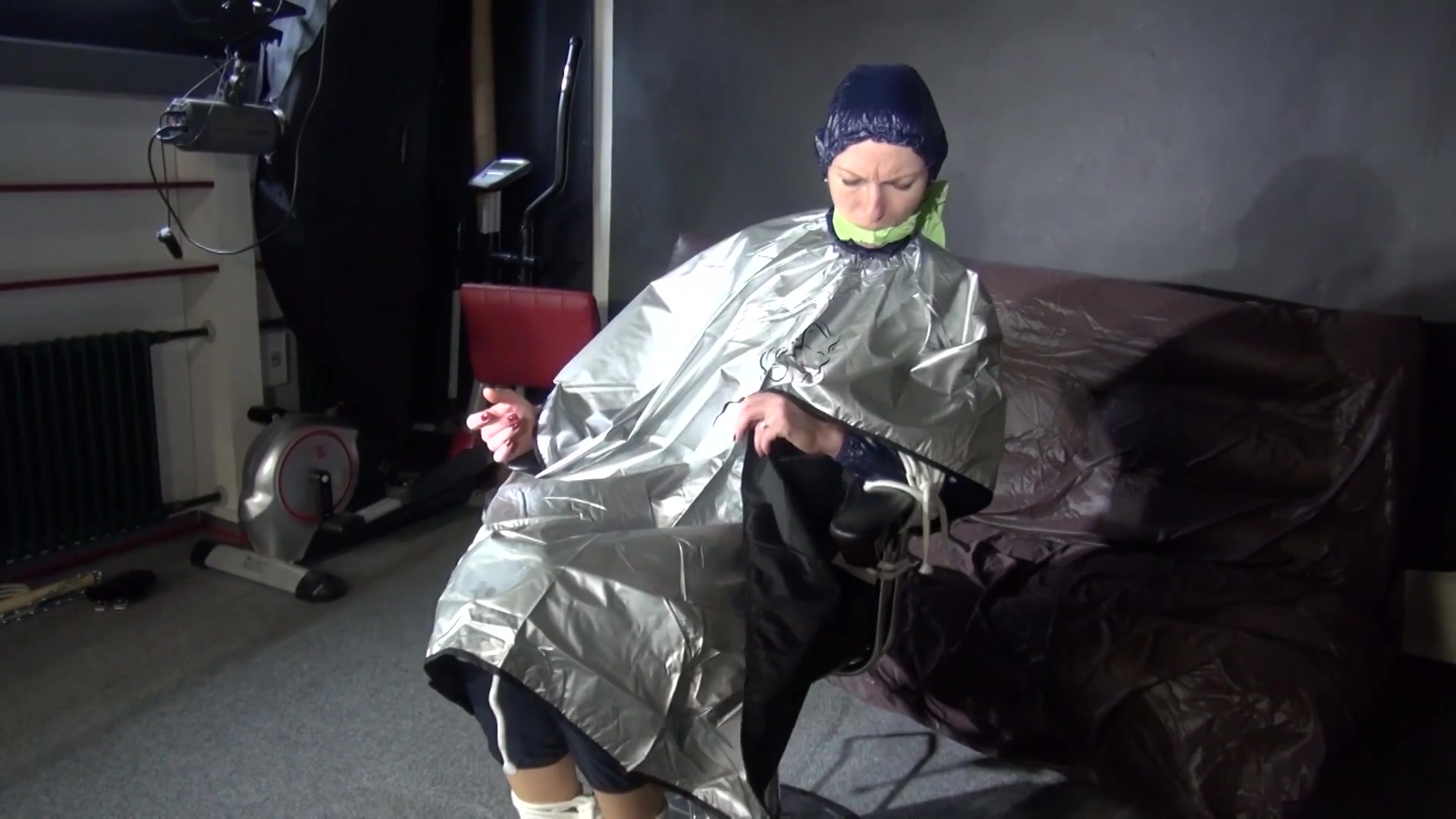 See Ronja Tied And Gagged On A Barber Chair In Shiny Nylon Rainwear And A Shiny Cape!