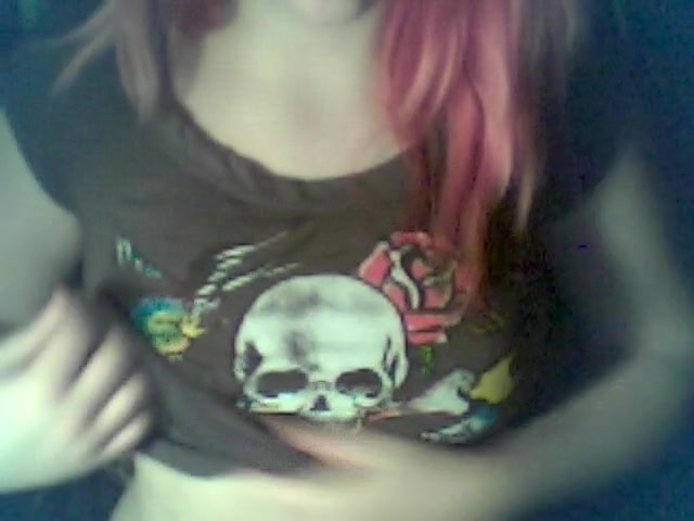 Red-haired emo babe showing her beautiful tits on camera