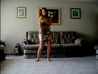 Hot Latina strip-dancing and demonstrating her body