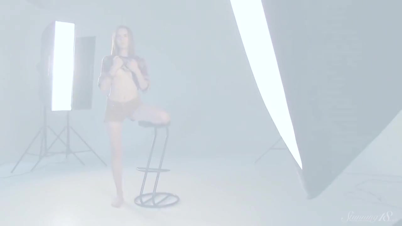 Sensual Dark Haired Coed Poses Naked While Rubbing Her Pussy