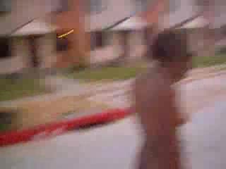 Curly black slut walks naked around the neighborhood