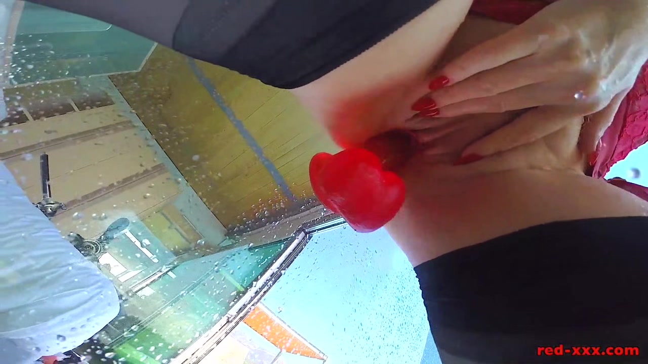 Mature redhead fucks a big dildo in the shower