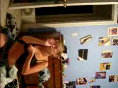 Blonde young girl taking her clothes off slowly