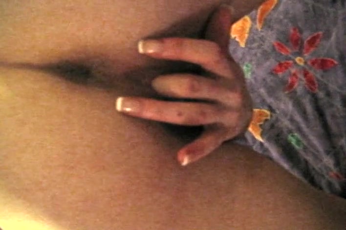 Sexy Asian babe stripping in front of a camera