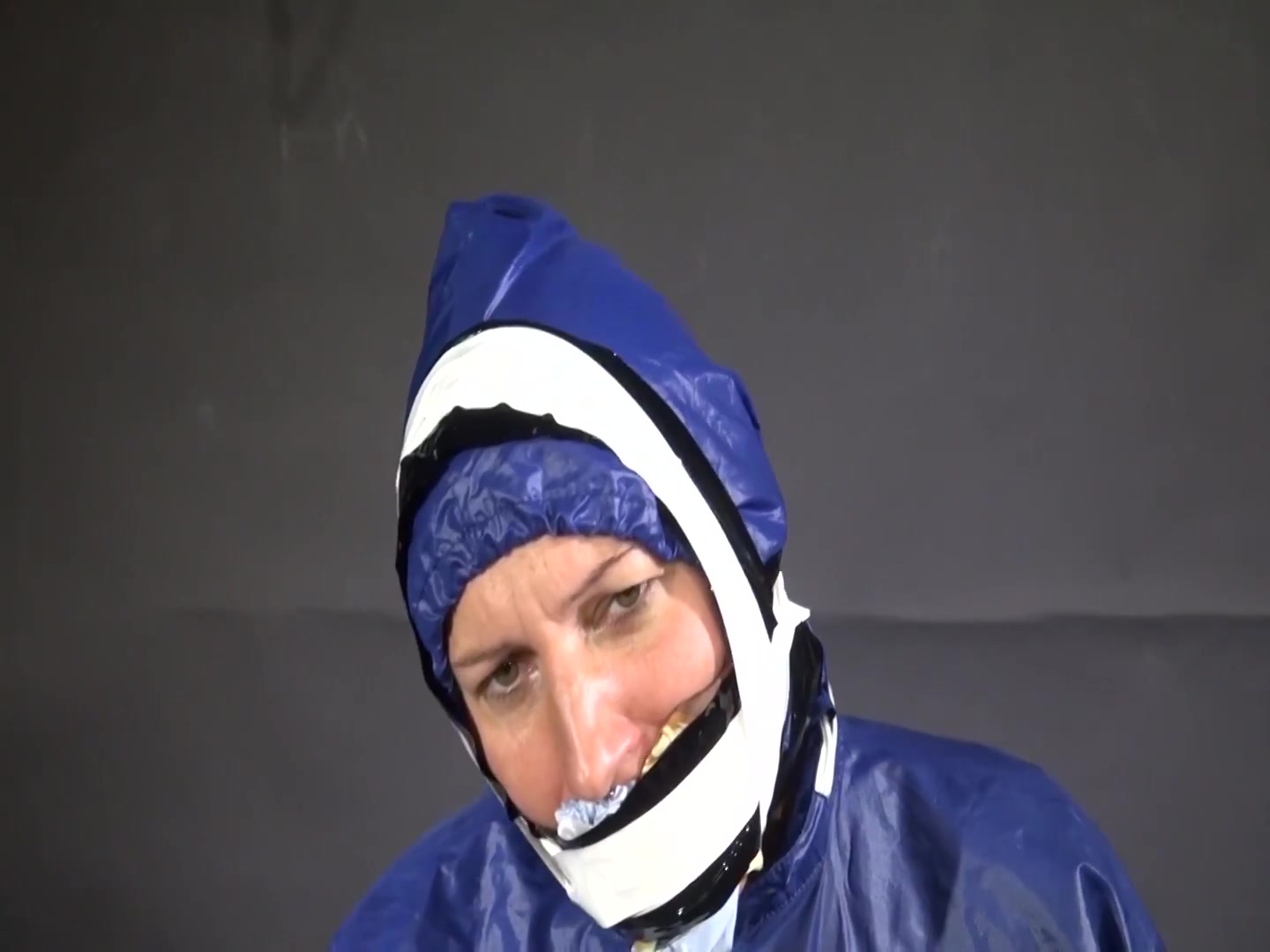 Watch Sandra Beeing Bound, Pantygagged And Finally Pantyhooded In Her Shiny Nylon Rainwear