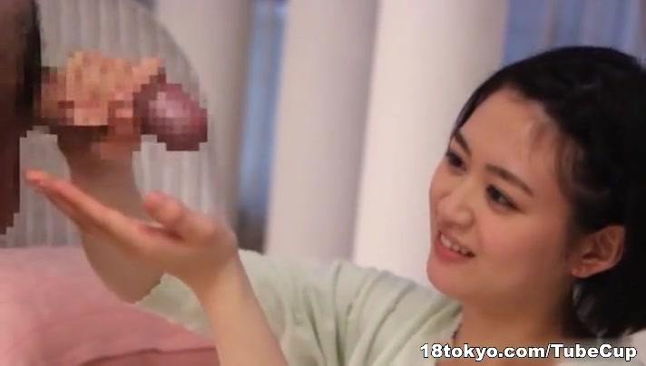 Erina Nagasawa kneels in front of a big cock to suck