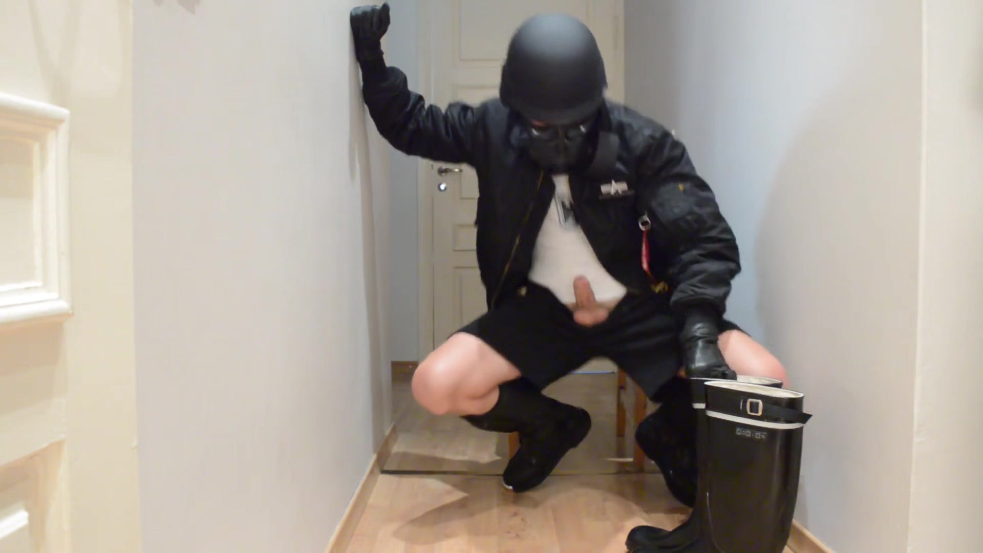 Gas masked guy cums on his rubber boots