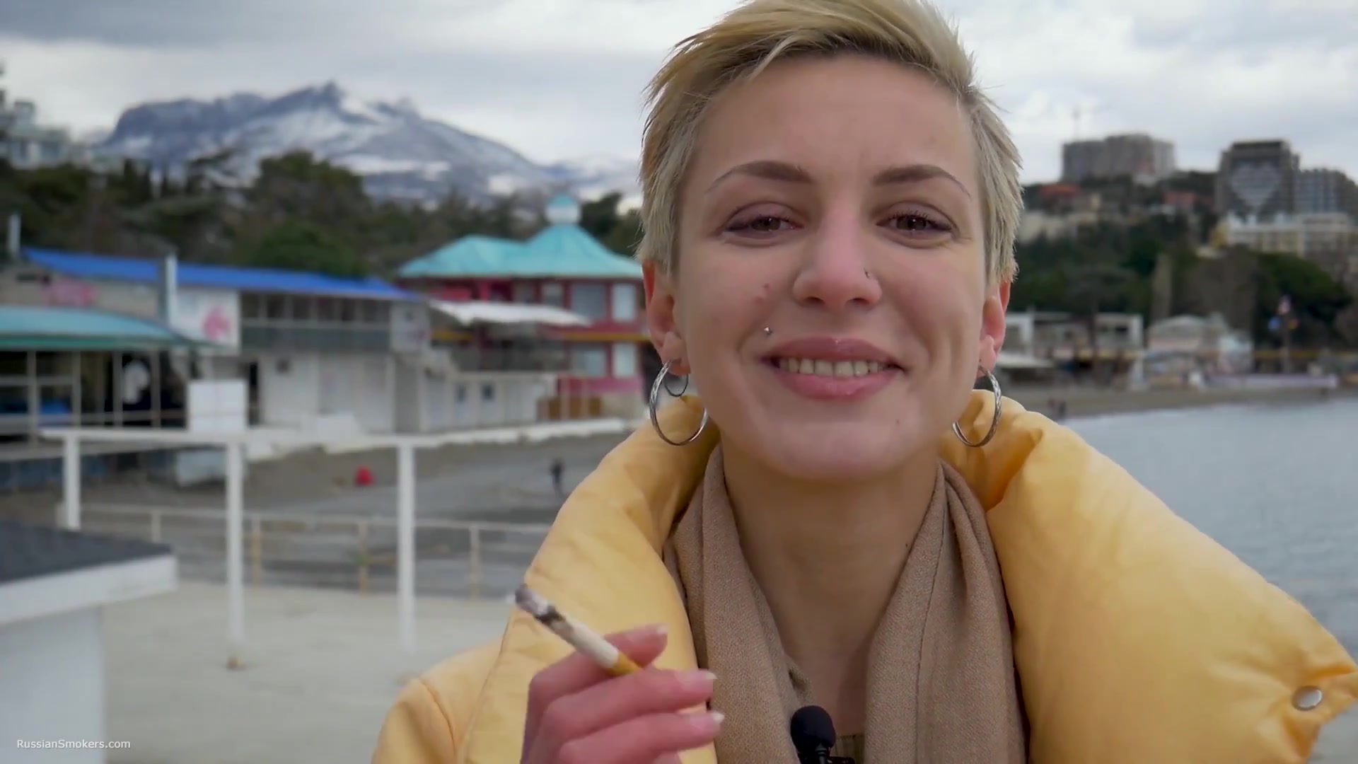Short Cut Hair Blonde Girl Is Smoking Two Cork Cigarettes
