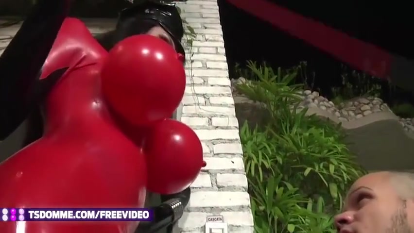 Brunette Tranny In Red Latex Outfit Fucks A Dude By The Pool