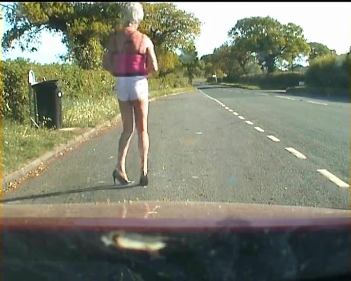 Amateur crossdresser in lingerie on a road