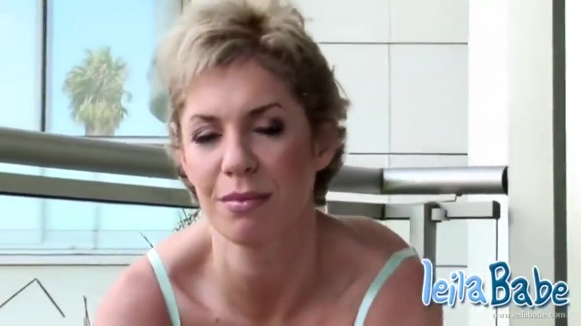 Busty Blonde Milf Strips Off On Balcony