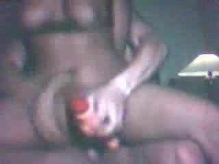 Black slut tries to fuck a guy and dildo her ass at the same time
