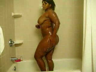 Ebony bitch with curves washes her brown twat in the shower