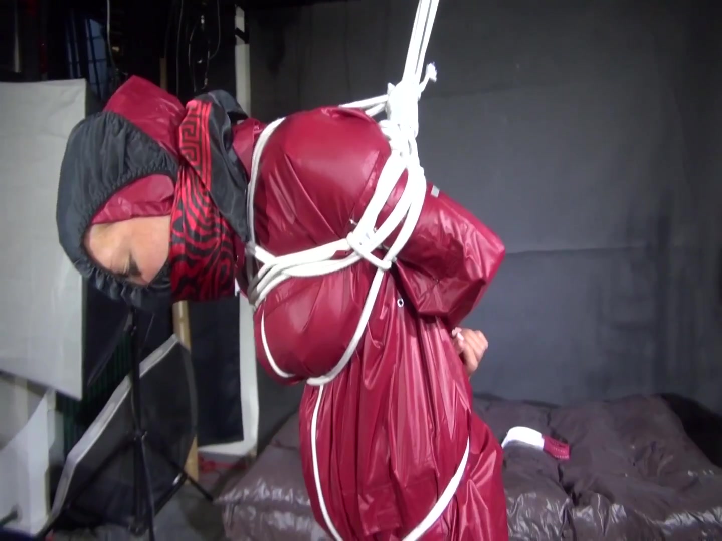 Watch Sandra Beeing Bound Gagged And Pantyhooded In Her Shiny Nylon Rainwear