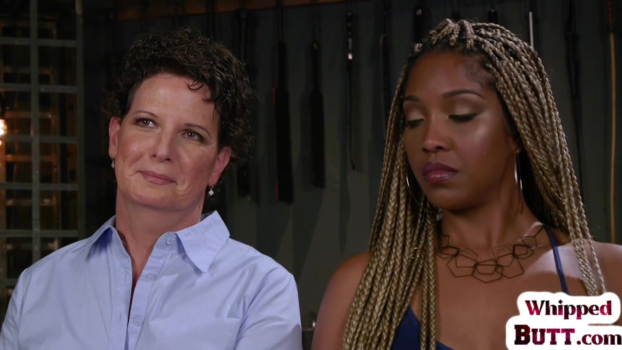 Whipping ebony dyke punishes trapped lesbian with toys