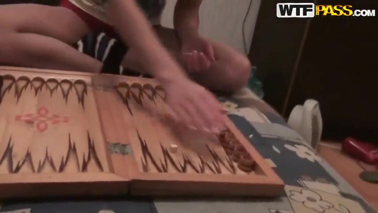 Russian girl Nastya and her classmate playing backgammon