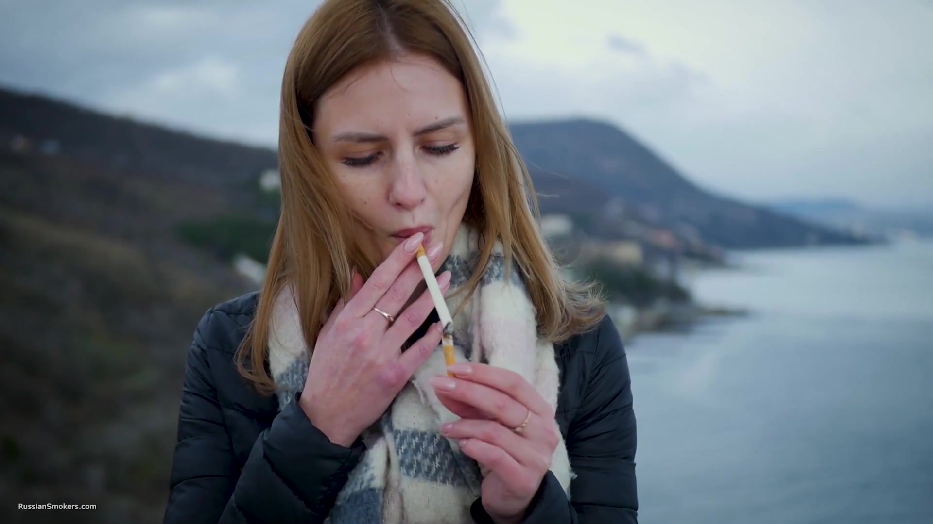 Beautiful Lady Is Smoking Two Saratoga Cigarettes In A Row On A Beautiful View