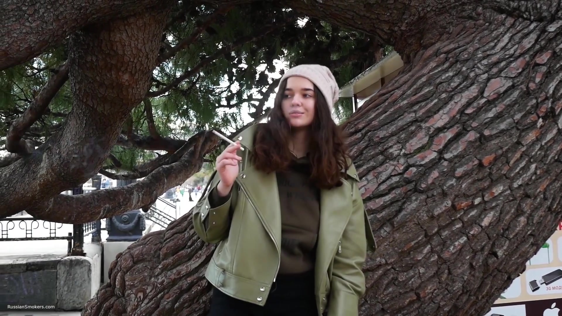 Young Brunette Is Taking An Unhurried Stroll With Allwhite 120mm Cigarette