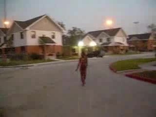Curly black slut walks naked around the neighborhood